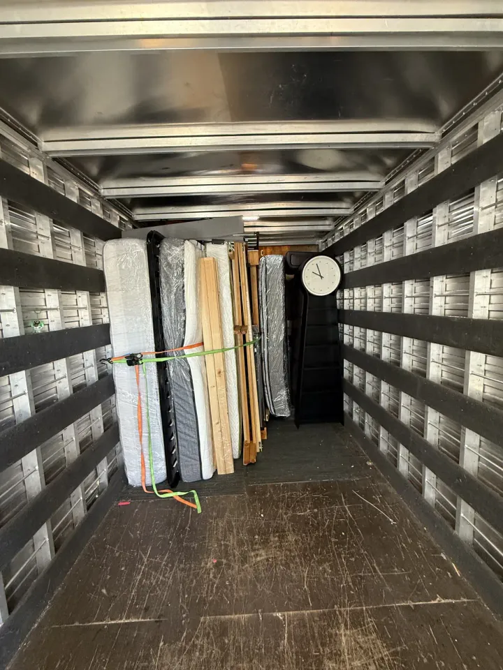 A Brothers Movers truck packed and strapped for the road
